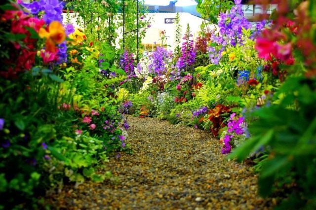 The walking area is a flower garden with a sweeping layout and winding paths.